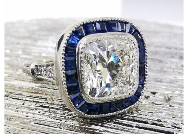 https://comparethediamond.com/image/cache/catalog/blog-images/ART%20DECO%20TARGET%20RING-630x450-630x450.webp