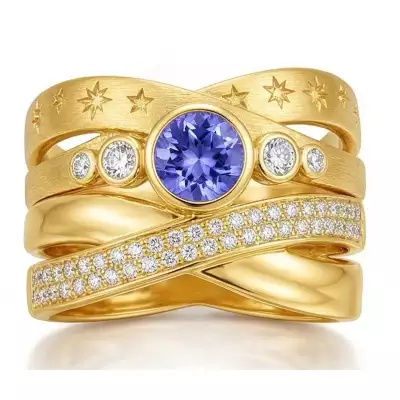 Celestial wrap-style band ring – recommissioned jewellery design featuring reused gemstones and precious metal