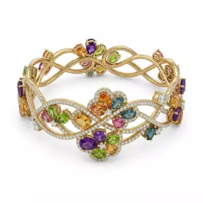 Interwoven gemstone bangle – recommissioned jewellery design featuring reused gemstones and precious metal
